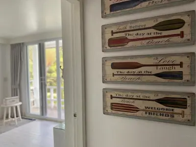 a wall with several signs on a wall at Patong seaview 2bedrooms white house in Patong Beach