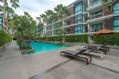a swimming pool in front of a building at C201 Neatest Apartment The title 50m to beach and shops in Rawai Beach