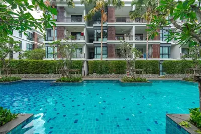 a swimming pool in front of a building at C201 Neatest Apartment The title 50m to beach and shops in Rawai Beach