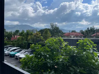 a group of cars parked in a parking lot at Studio Apartment, Bang Tao Phuket in Laguna Phuket
