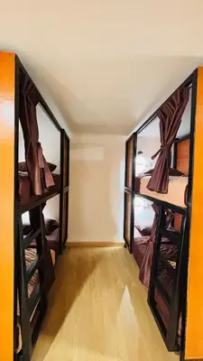 a room with three bunk beds in it at Brightstar Hostel in Phi Phi Don