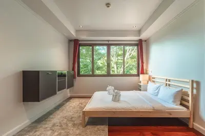 a bedroom with a large bed and a window at V151 Nicest Villa With The Best Views In Phuket in Thalang
