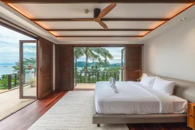 a bedroom with a large bed and a balcony at V151 Nicest Villa With The Best Views In Phuket in Thalang
