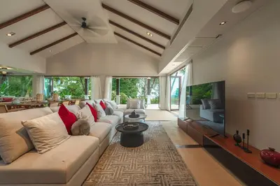 a living room with a couch and a tv at V151 Nicest Villa With The Best Views In Phuket in Thalang