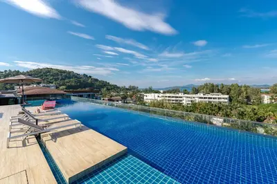 a swimming pool on top of a building at C153 The Aristo Luxury Beach Resort Phuket in Thalang