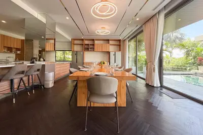 a kitchen and dining room with a table and chairs at Villa Lion Phuket in Phuket