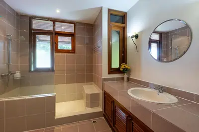 a bathroom with a sink and a mirror at Villa Moon Talay Panorama View in Patong Beach