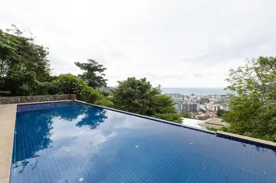 a swimming pool with a view of the city at Villa Moon Talay Panorama View in Patong Beach
