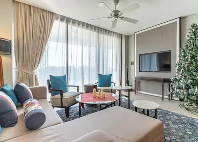 a living room with a christmas tree and a couch at Infinite Ocean Retreats at Angsana Oceanview in Laguna Phuket
