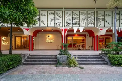 a building with stairs and tables and chairs at Summer Sea Phi Phi Island in Phi Phi Don