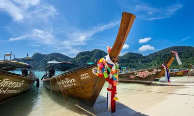 a group of boats parked on the beach at Summer Sea Phi Phi Island in Phi Phi Don