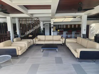 a lobby with couches and tables in a building at Luxury Seaview 6 Bedrooms with Infinity Pool Villa, private Gym, Superfast WIFI in Surin Beach