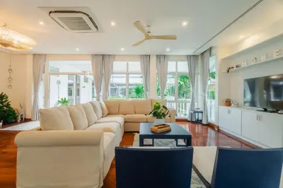 a living room with a couch and a tv at Seaside Bliss Beach Villa Rawai in Rawai Beach