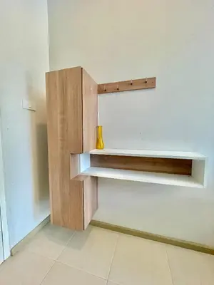 a shelf on a wall with a vase on it at 1 bedroom pool view in Bangtao in Thalang