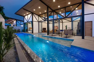 an indoor swimming pool in a house with a house at Brand-New 22m Oxygen Pool Villa Sunset Garden 9 in Rawai in Rawai Beach