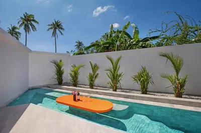 a pool with a table in the middle of a house at Brand-New 22m Oxygen Pool Villa Sunset Garden 9 in Rawai in Rawai Beach