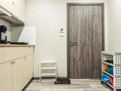 a door in a kitchen with a ladder next to it at Apartments pool view in Title Residence Naiyang in Nai Yang Beach