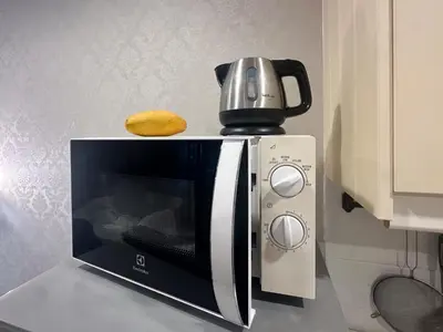 a coffee pot sitting on top of a microwave at Apartments pool view in Title Residence Naiyang in Nai Yang Beach