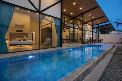 an indoor pool in a house with a bedroom at New, Modern & Stylish 17m Eco Pool Villa Sunset Garden 11 in Rawai in Rawai Beach