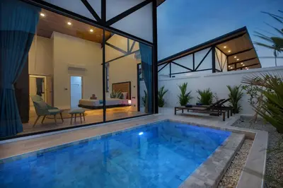 a swimming pool in the backyard of a house at Trendy & New 19m Oxygen Pool Villa Sunset Garden 10 in Rawai in Rawai Beach