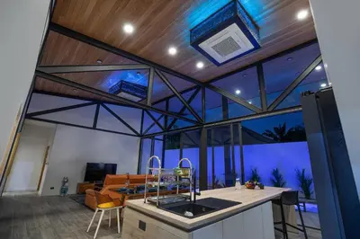 an open kitchen with a view of a living room at Trendy & New 19m Oxygen Pool Villa Sunset Garden 10 in Rawai in Rawai Beach