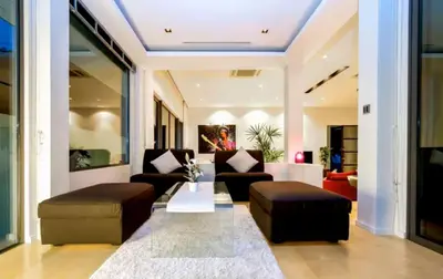 a living room with two couches and a table at 15 - Ocean View Oasis in Kalim Beach in Patong Beach