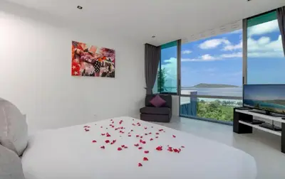 a bedroom with a bed with hearts on the floor at 15 - Ocean View Oasis in Kalim Beach in Patong Beach
