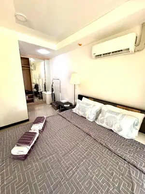 a hotel room with a large bed with two mattresses at NBC апартаменты у пляжа in Rawai Beach