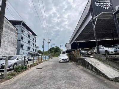 a white car parked in front of a building at Terminal2 Hotel Phukettown in Phuket Town