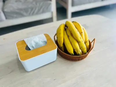 a bunch of bananas in a basket next to a box at Terminal2 Hotel Phukettown in Phuket Town