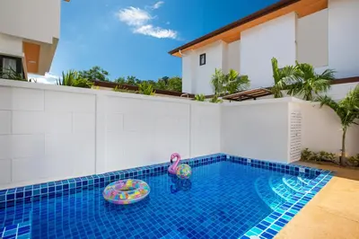 a swimming pool with a toy in the middle of it at Newly Built 3BR Pool Villa Goldena 12B in Kamala in Kamala Beach