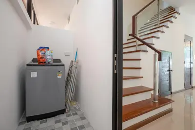 a refrigerator in a room with a staircase at Newly Built 3BR Pool Villa Goldena 12B in Kamala in Kamala Beach