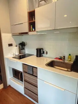 a kitchen with a sink and a counter top at Cozy Paradise By Rawai Beach in Phuket Town