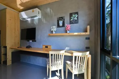 a home office with a desk and chairs at ReLife The Windy Naiharn in Rawai Beach