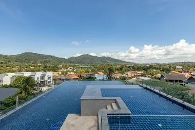 an image of a swimming pool at a resort at ReLife The Windy Naiharn in Rawai Beach