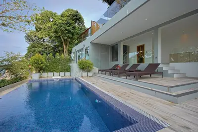 a villa with a swimming pool and a house at Centara Villas Phi Phi Island in Phi Phi Don