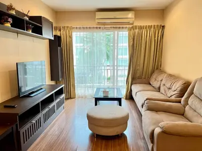 a living room with a couch and a tv at Luxury Villa Patong in Patong Beach