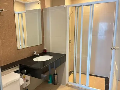 a bathroom with a sink and a glass shower at Luxury Villa Patong in Patong Beach