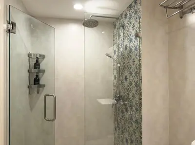 a shower with a glass door in a bathroom at The Title Residences Apartment 7 min walk to Nai Yang Beach in Nai Yang Beach