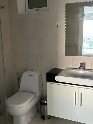 a bathroom with a toilet and a sink at Ocean View Residences! in Karon Beach