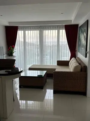 a living room with a couch and a table at Ocean View Residences! in Karon Beach