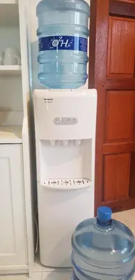 a refrigerator filled with water bottles on top of it at Beach Front Sand Castle - kid friendly right on the perfect beach in Ban Ao Makham