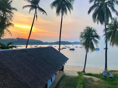 a view of a beach with palm trees and boats at Beach Front Sand Castle - kid friendly right on the perfect beach in Ban Ao Makham