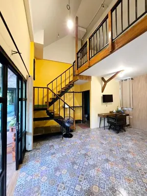 an empty room with a staircase and a desk at Baibon 4 Homestay Thalang Phuke in Thalang
