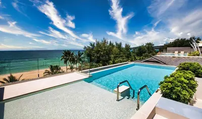 a swimming pool with a view of the beach at Laguna Seaview Penthouse with Rooftop Pool 50 m to Bang Tao Beach in Bang Tao Beach