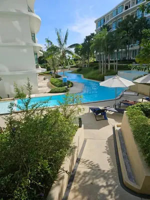 a swimming pool at a hotel with a resort at HomeAwayFromHome in Phuket Town