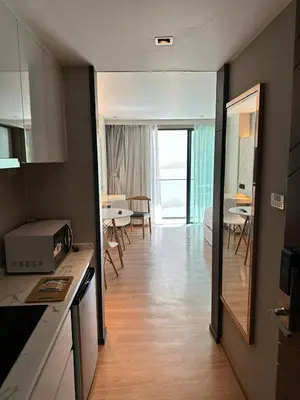 a room with a kitchen and a dining room at HomeAwayFromHome in Phuket Town