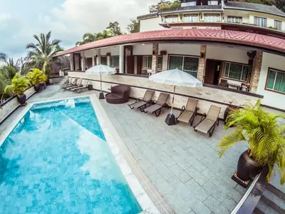 an aerial view of a house with a swimming pool at Baan Sung Apartments in Kamala Beach