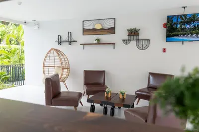 a waiting room with chairs and a table at Seaside Naithon Phuket - Newly Opened in Nai Thon Beach