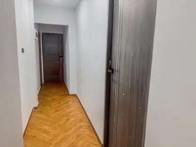 a hallway with a door and a wooden floor at Nordic Hostel I Female Only I Dorms only in Phi Phi Don